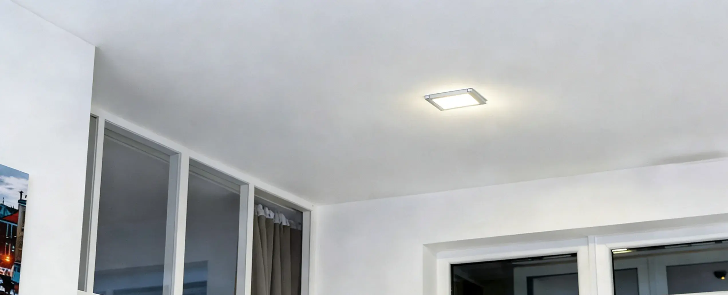 Ceiling light flickering in a home — common causes and when to call an electrician.